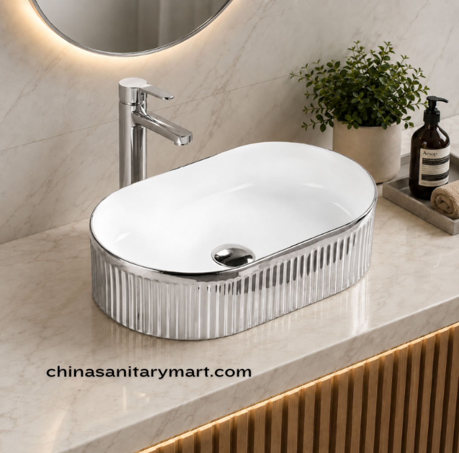 IS-A330S 14×24 Inch luxury countertop wash basin featuring a glossy white ceramic interior with a ribbed metallic silver exterior, oval tabletop design, premium vitreous ceramic construction